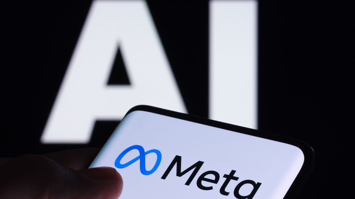 A mobile device displaying the Meta logo in front of large letters spelling out &#039;AI&#039;