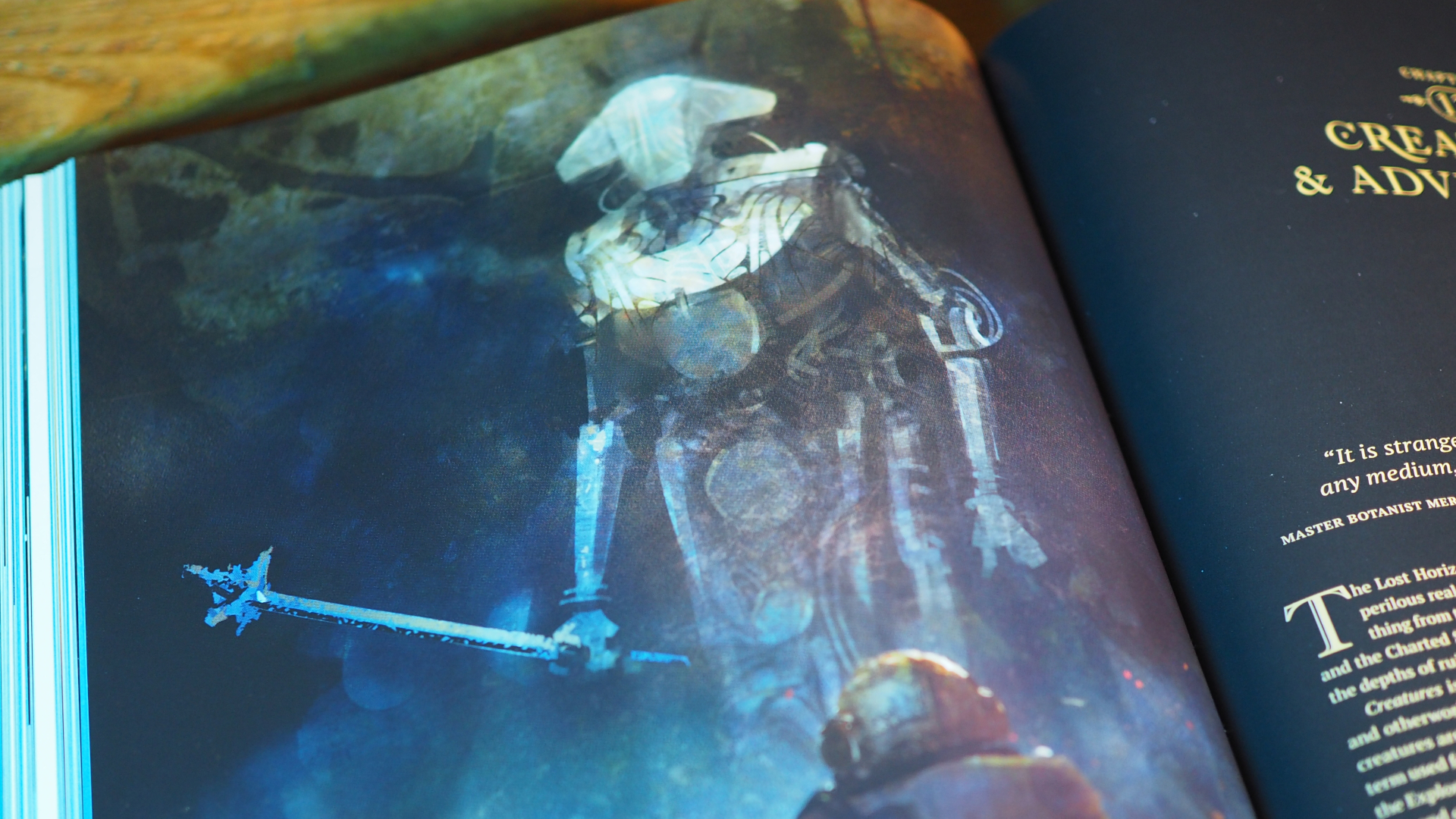 An image of a robot with a spear in a book laid out on a wooden surface