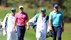 Rory McIlroy and Brooks Koepka walk during the 2022 Masters