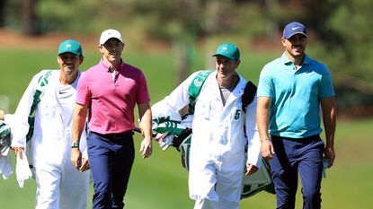 Rory McIlroy and Brooks Koepka walk during the 2022 Masters