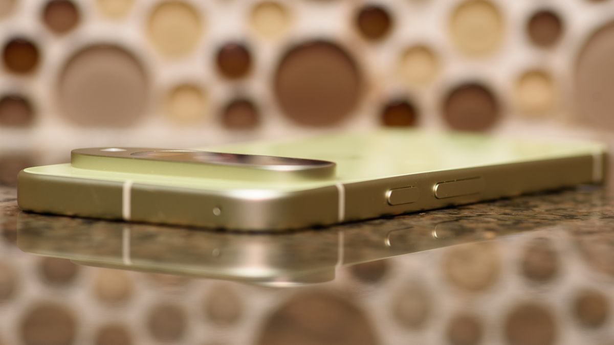 Google Pixel 10 in Lemongrass against a bubbly backsplash