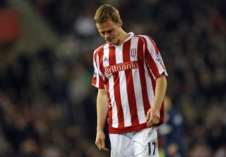 Stoke's English defender Ryan Shawcross walks from the field after being sent off by referee Peter Walton (not pictured) for a challenge on Arsenal's Welsh player Aaron Ramsey (not pictured) during the English Premier League football match between Stoke City and Arsenal at the Britannia Stadium, Stoke-on-Trent, Staffordshire, central midlands, England on February 27, 2010.