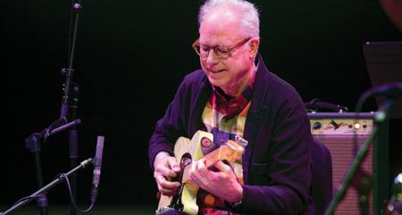 Bill Frisell in his element, onstage with a guitar