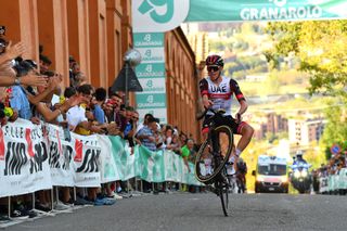 Tadej Pogacar pops a wheelie for the fans at the 2021 Giro dell&#039;Emilia