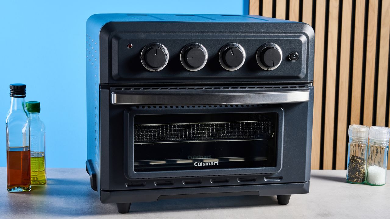 the cuisinart air fryer and toaster oven toa-60 with a black exterior, four temperature and timer dials