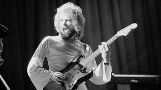 Eric Bell from Thin Lizzy performs live on stage in 1973