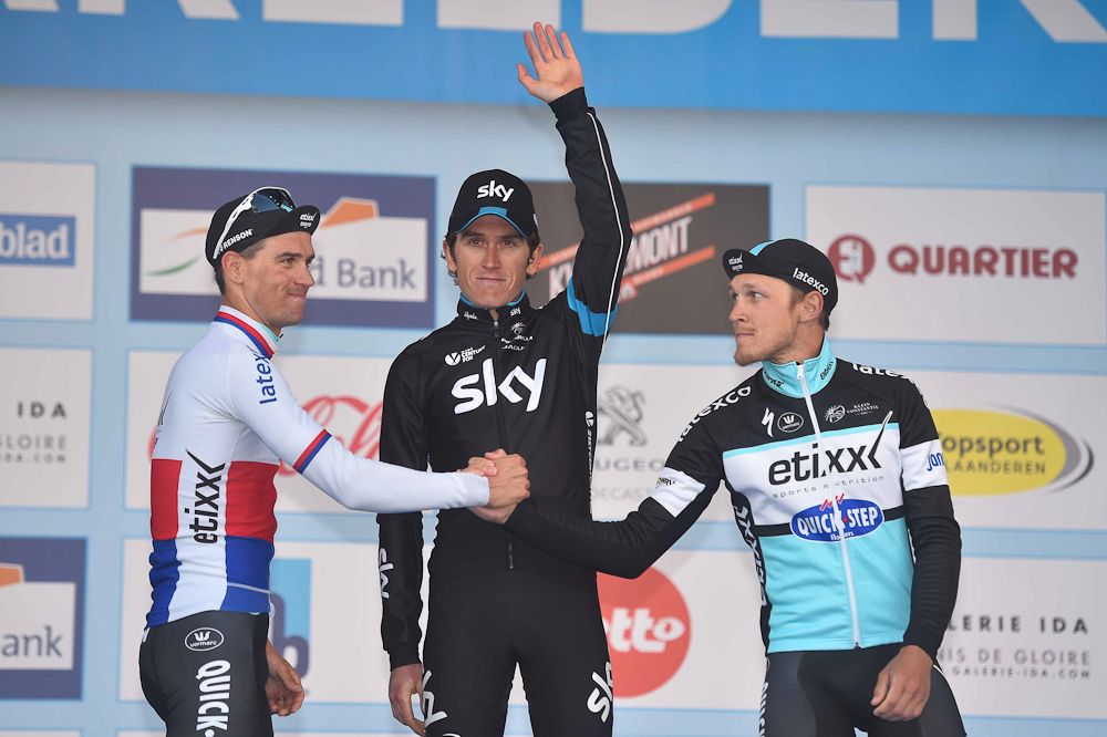 The Etixx-QuickStep riders shake hands in front of race winner Geraint Thomas.