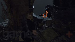 Resident Evil 4 Remake Cliffside Ruins Blue Medallion on rock outside the window