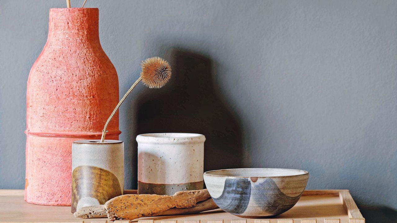 Wooden sideboard with curated vase and bowls displayed