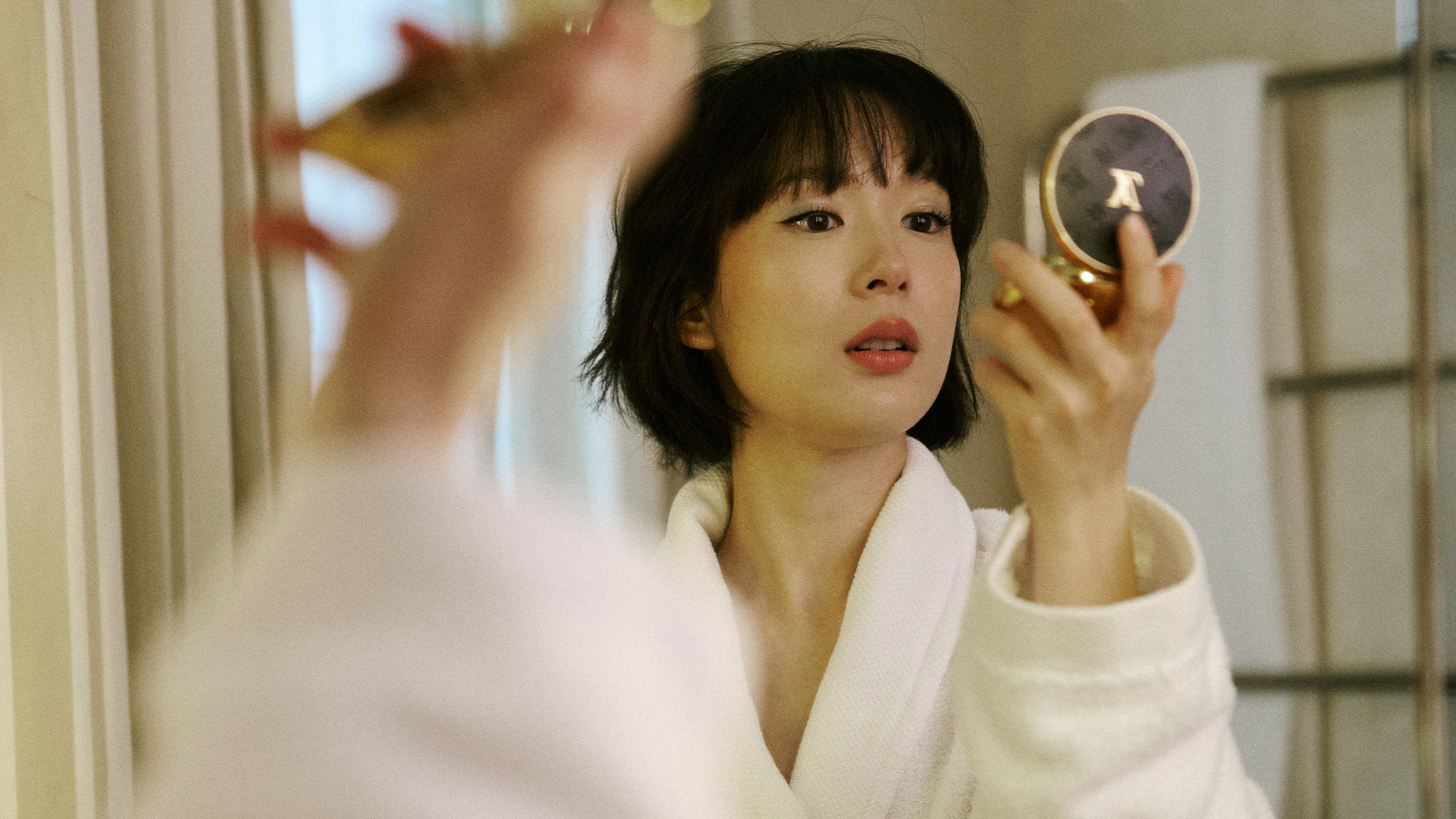 Moeka Hoshi getting ready for the Louis Vuitton spring 2026 show.