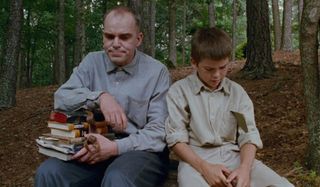 Sling Blade Billy Bob Thornton sits with a kid in the woods