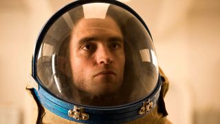 Scene from the movie Mickey 17. Close up of a serious-looking man&#039;s face whilst he&#039;s wearing a spacesuit/space helmet.