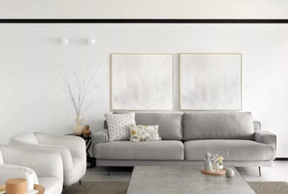 white living room with grey sofa by U+A