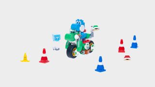 Lego Yoshi on a motorcycle amongst accessories and obstacles, all against a plain background