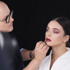 Peter Philips applying Dior's fall makeup collection on Deva Cassel. 