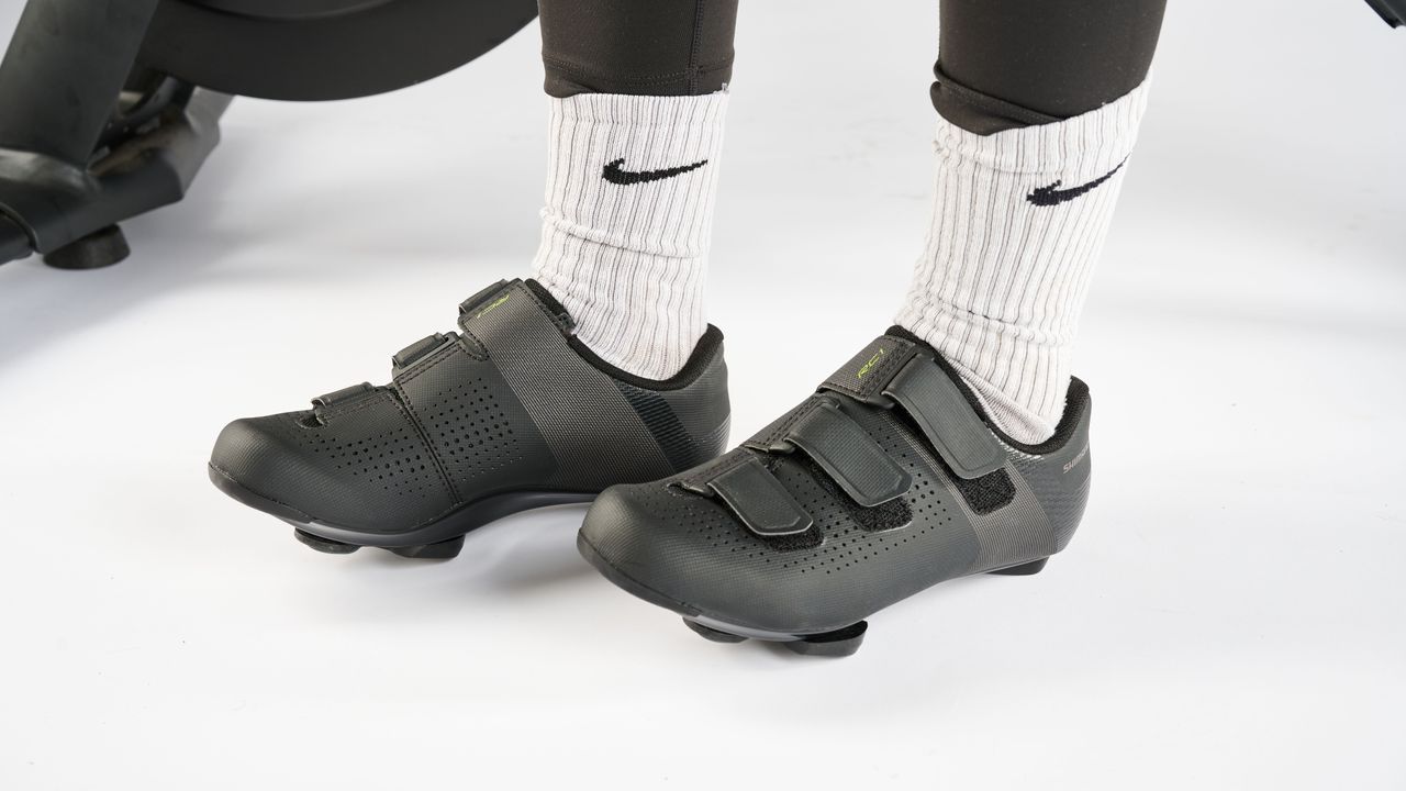 Person wearing Shimano RC1 cycling shoes