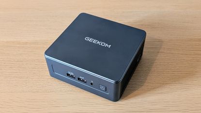 The Geekom Mini IT13 on a desk