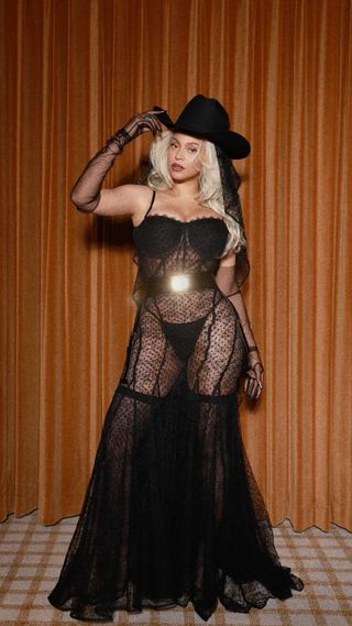 Beyoncé wore a sheer lace black gown and a cowgirl hat on Valentine's Day 2024