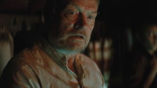 Jared Harris looking concerned in the glow of a ship's controls in Foundation.