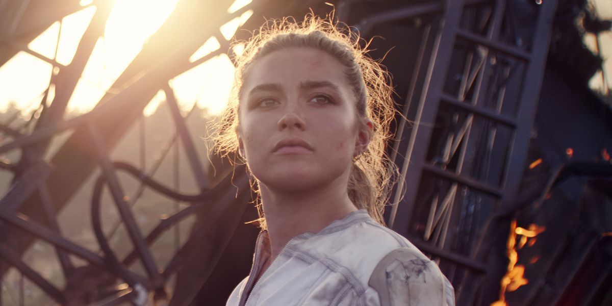 Yelena Belova (Florence Pugh) stands in front of burning wreckage in &#039;Black Widow&#039;