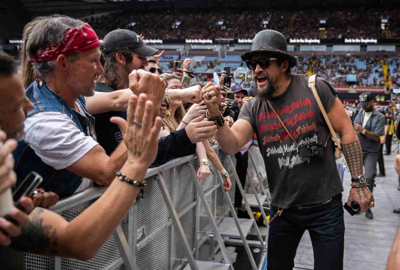 Jason Momoa shaking hands with the crowd at the Back To The Beginning show at Villa Park in July 2025