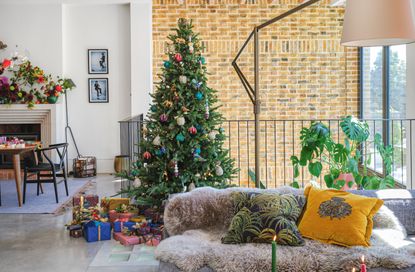 a colorful christmas tree in a modern home