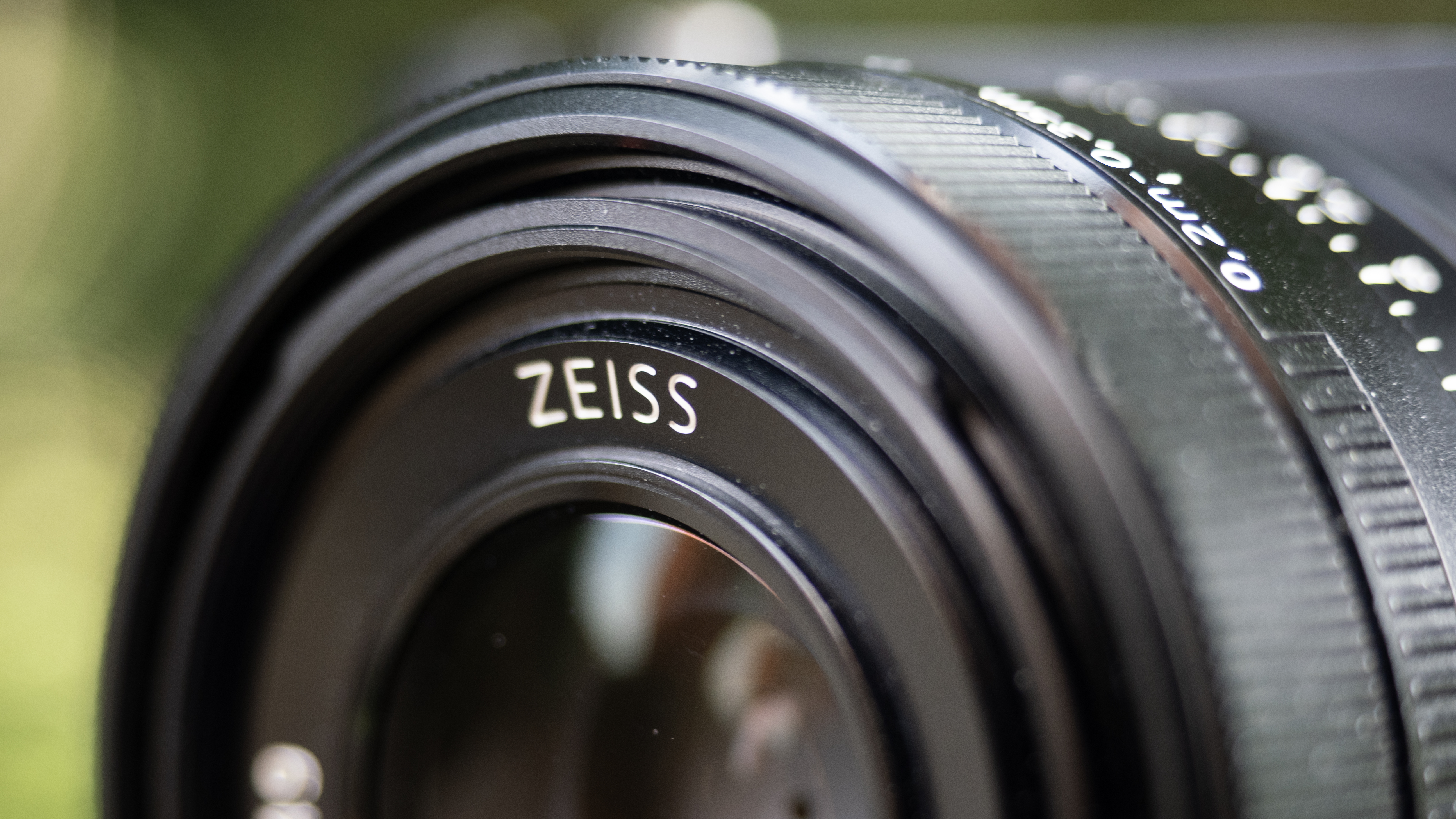 Sony RX1R III on a wooden surface in a woodland environment