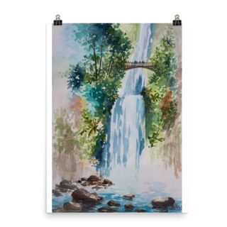 A watercolor waterfall print with blue and green colors, being held by two black clips