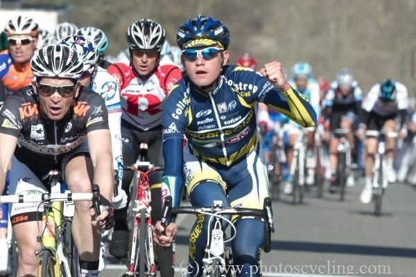 Rob Ruigh (Vacansoleil-DCM) celebrates his teammate De Gendt's success.