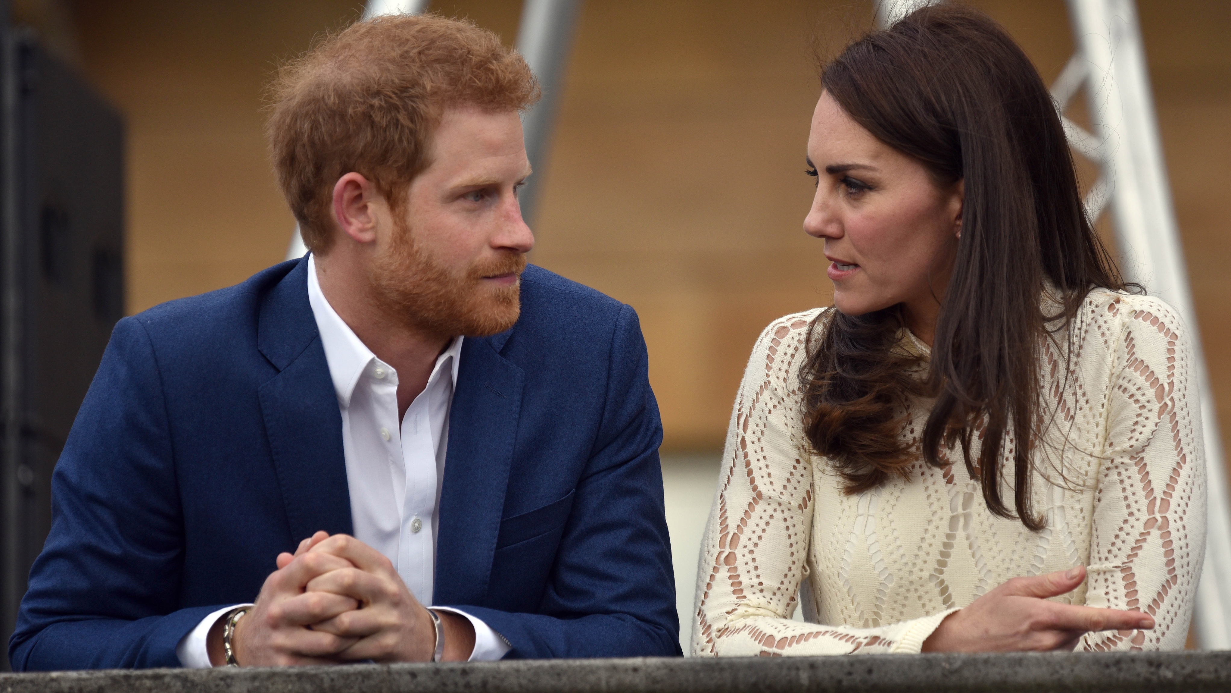 Catherine, Princess of Wales and Prince Harry speak as they host a tea party in the grounds of Buckingham Palace