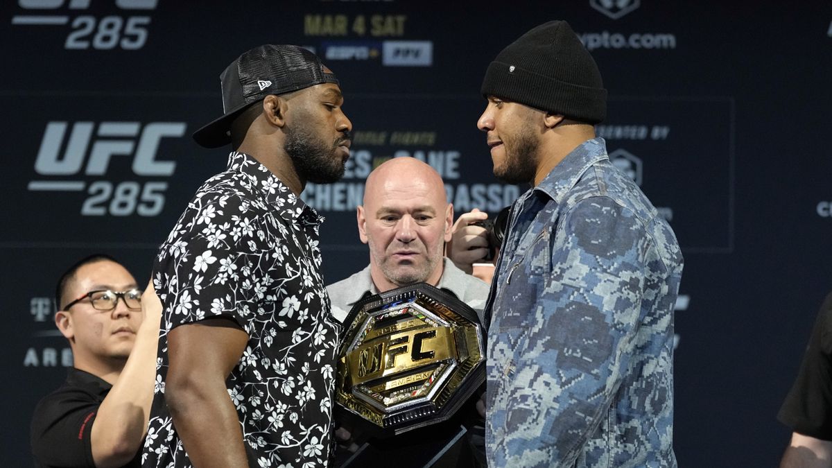 Jon Jones and Ciryl Gane of France face off during the UFC 285 press conference 