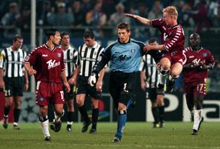 Hamburg goalkeeper Hans-Jorg Butt is congratulated by team-mates after scoring a penalty against Juventus in September 2000.