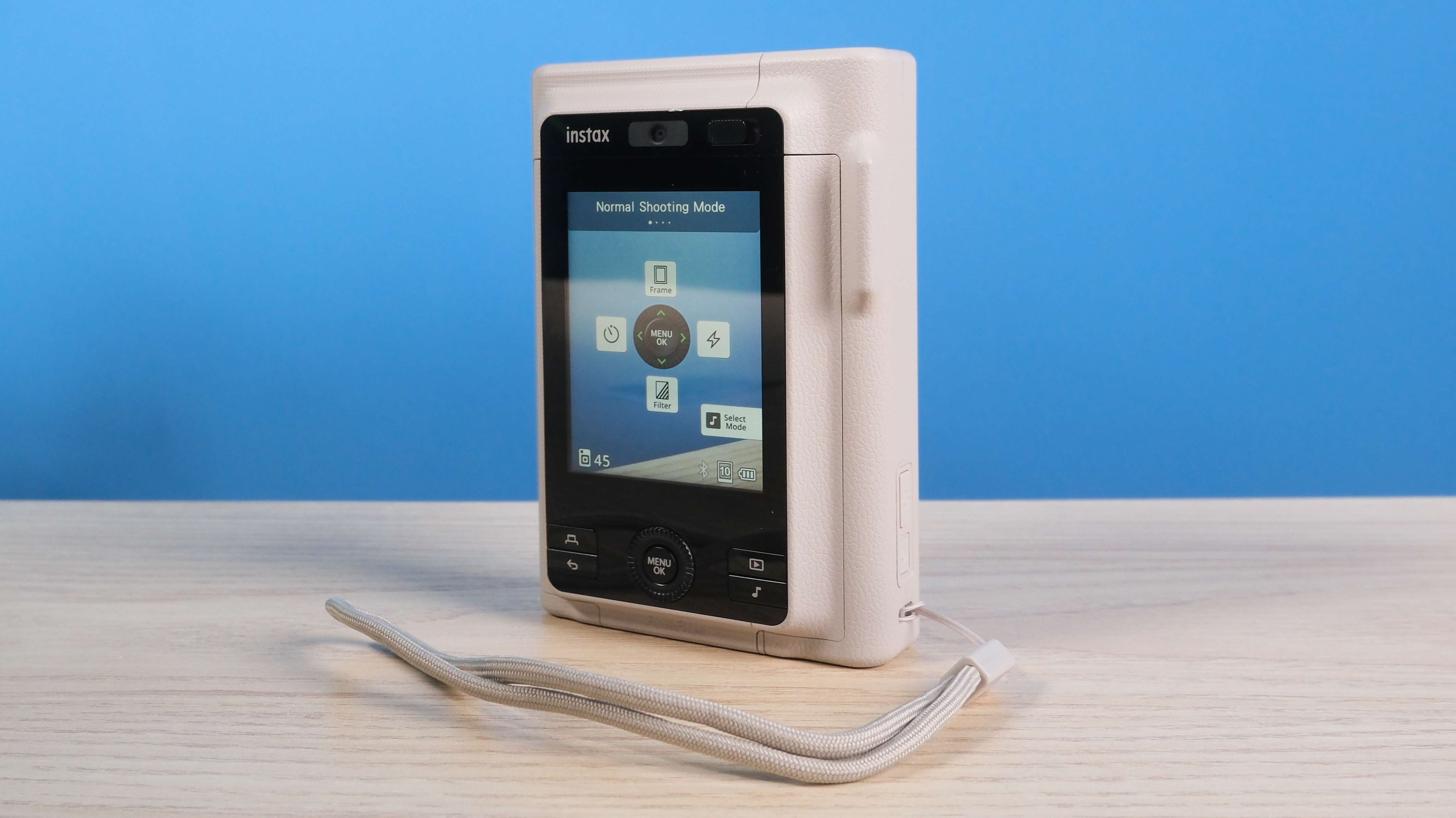 A Sand Beige Fujifilm Instax mini LiPlay Plus hybrid instant camera