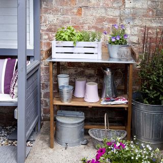 garden area with garden tools and wooden storage unit