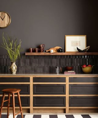 modern kitchen with dark brown walls and cabinets