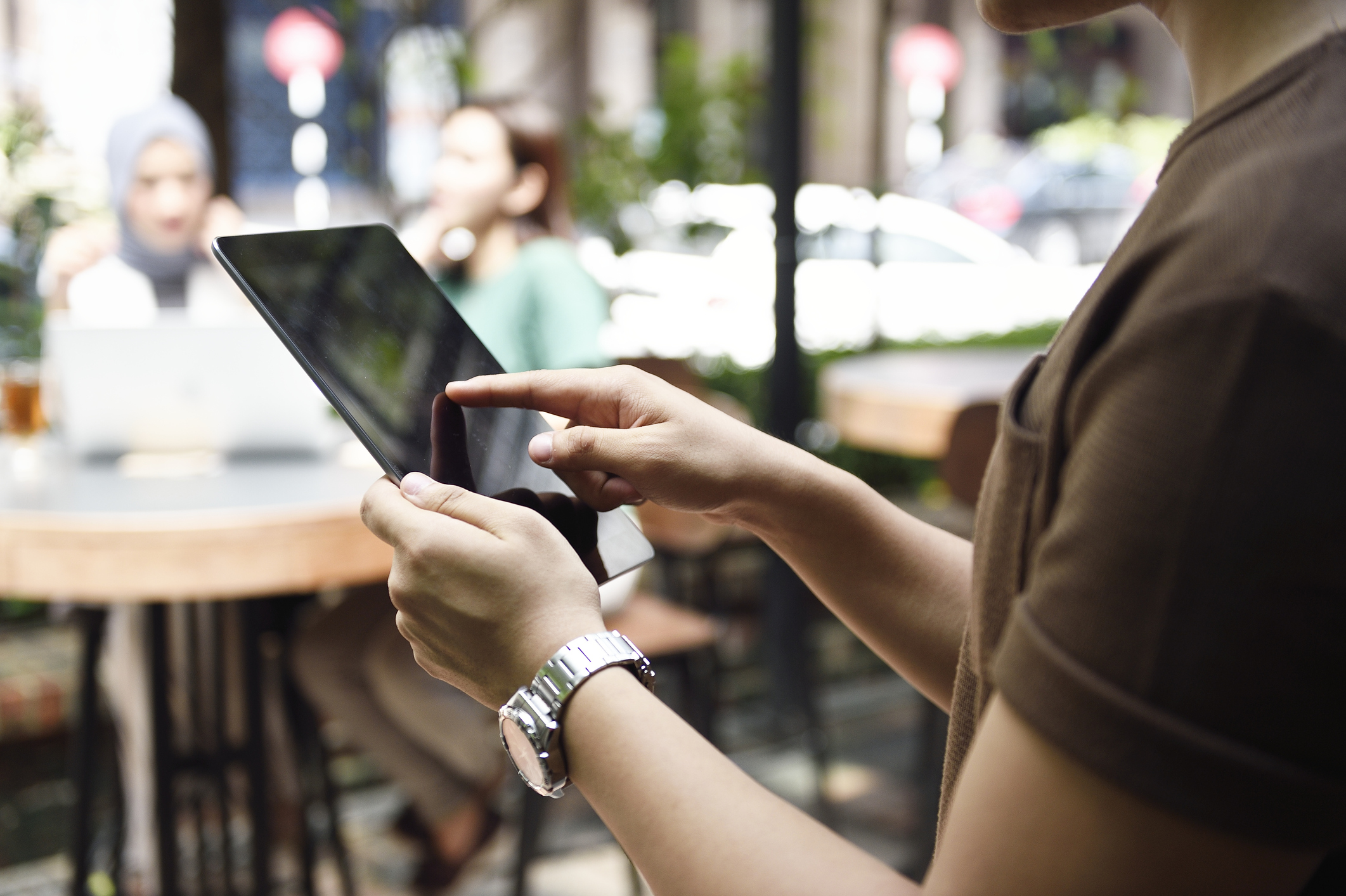 person using a tablet POS system