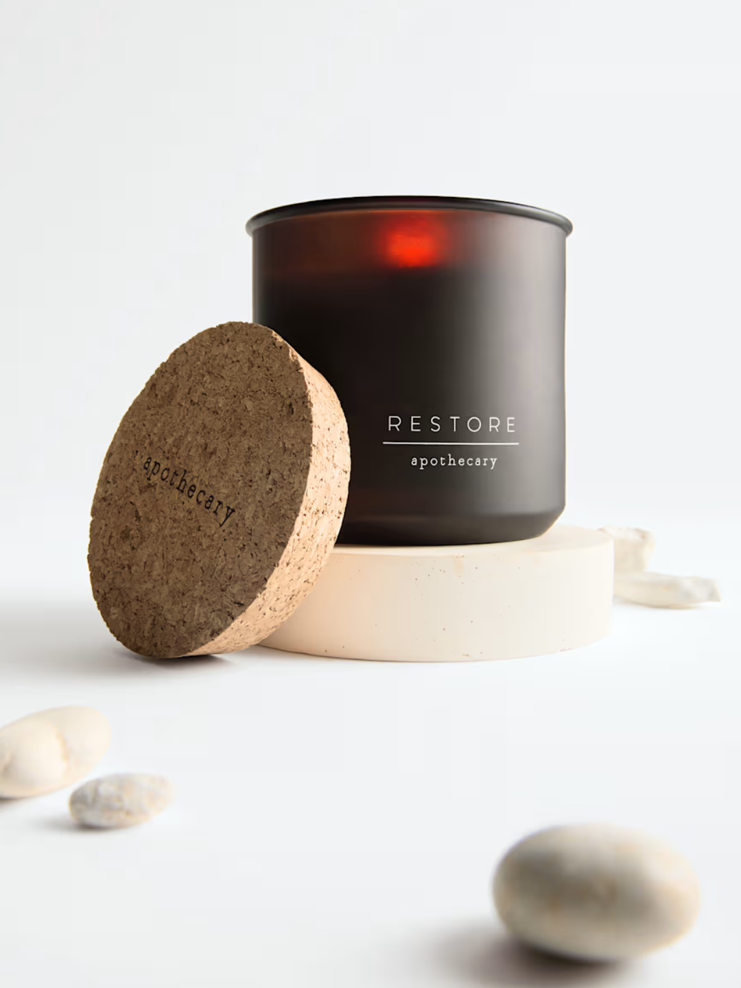 An amber glass restore candle from M&amp;amp;S