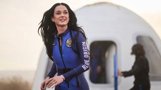 Pop star Katy Perry exits a Blue Origin space capsule after launch on April 14, 2025.
