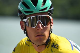 Team Boras Lukas Postlberger of Austria wearing the overall leaders yellow jersey looks on after the fifth stage of the 73rd edition of the Criterium du Dauphine cycling race a 175km between SaintChamond and SaintVallier on June 3 2021 Photo by Alain JOCARD AFP Photo by ALAIN JOCARDAFP via Getty Images