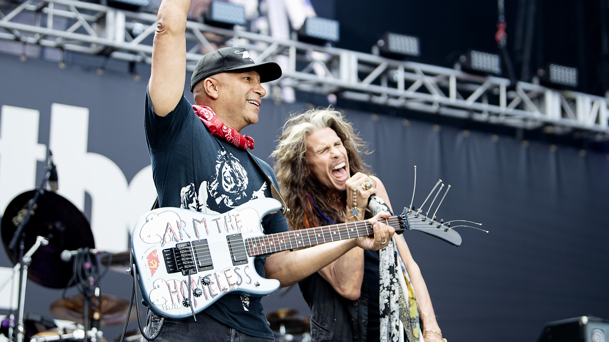 Tom Morello and Steven Tyler playing at Back to the Beginning