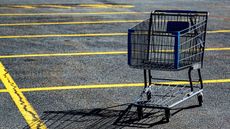 An abandoned shopping cart in a parking lot