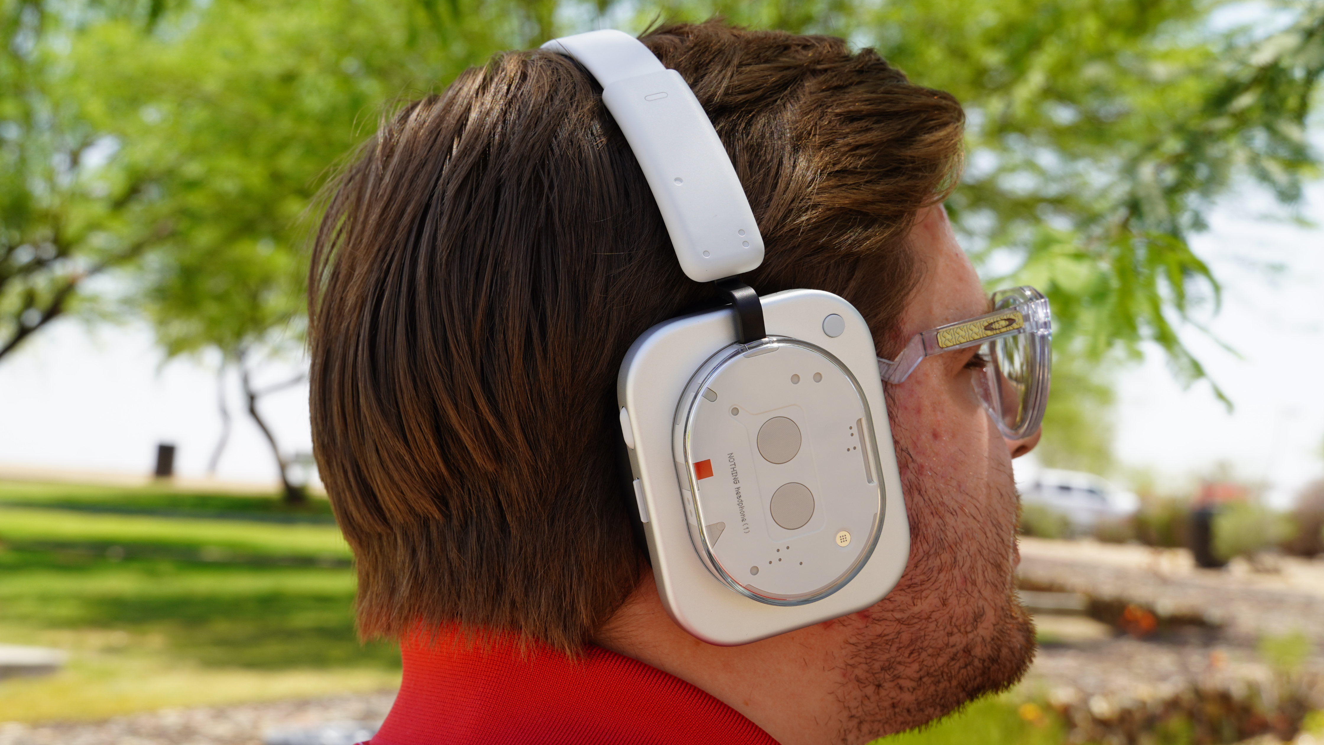 Wearing the Nothing Headphone 1 showing off the side of the headphones.
