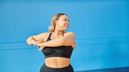 A woman performing side twist stretch