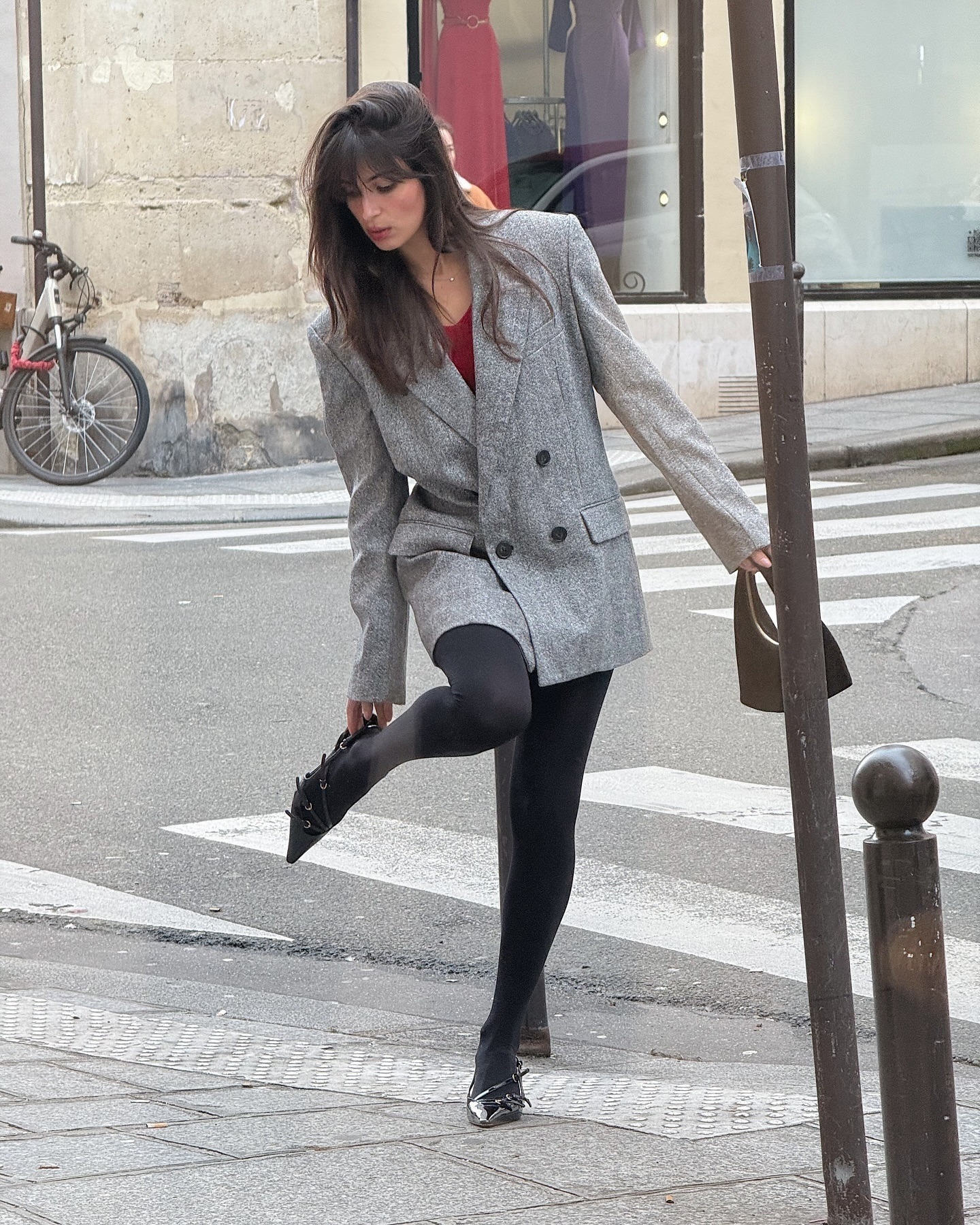 Woman wearing oversize blazer in street style shot.