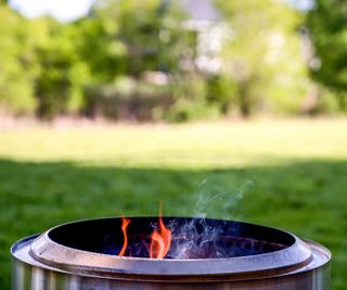 A smokeless fire pit in a garden