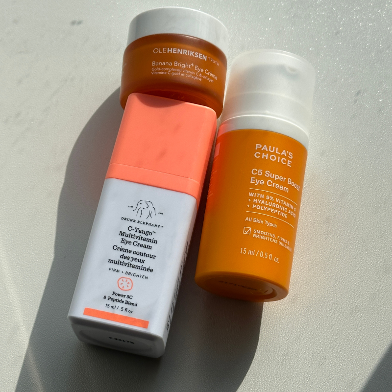 vitamin c eye creams on a white table