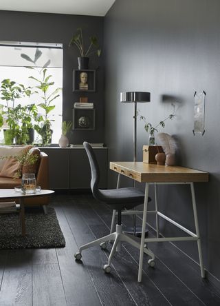 Ikea LILLÅSEN desk in a black living room