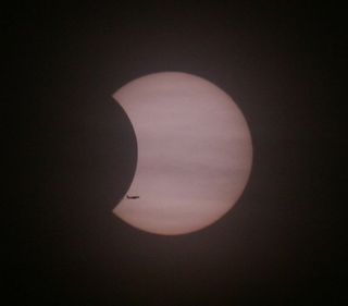 Skywatcher and photographer Dennis Put caught this amazing view of an aircraft flying across the face of the sun during the partial solar eclipse of Jan. 4, 2011. This photo was taken from Maasvlakte in The Netherlands.
