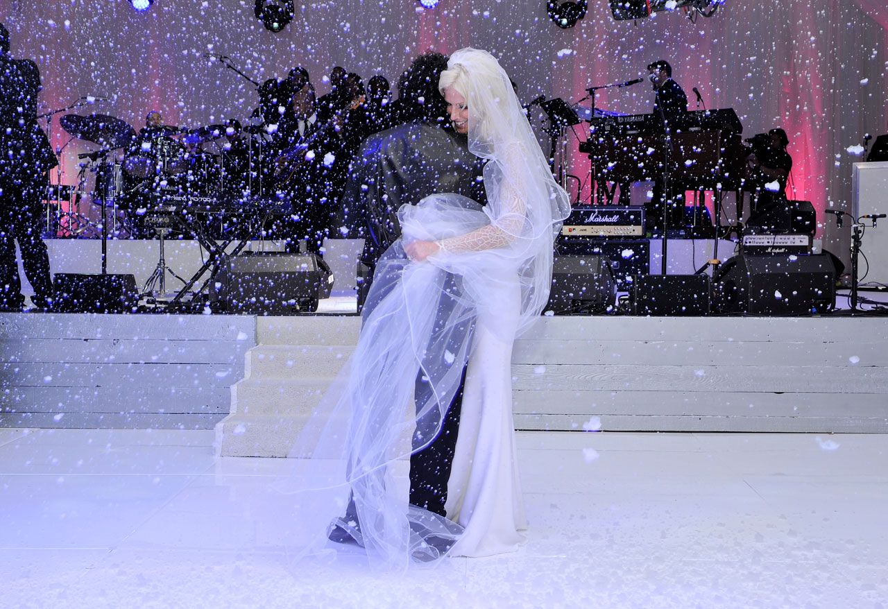 Neal Schon and Michaele Schon enjoy their first dance. It's indoors, but it's snowing. Go figure.