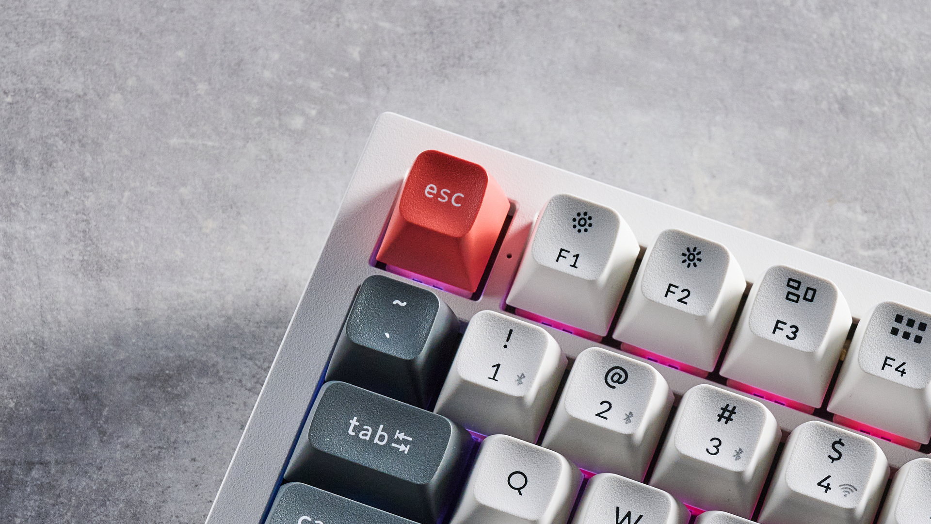 Keychron Q3 Ultra 8K photographed on a grey table in front of a blue background